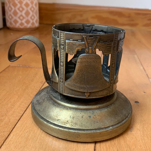 Other - VINTAGE BRASS CANDLE HOLDER.WITH LIBERTY BELL ON SIDES AND A HANDLE.